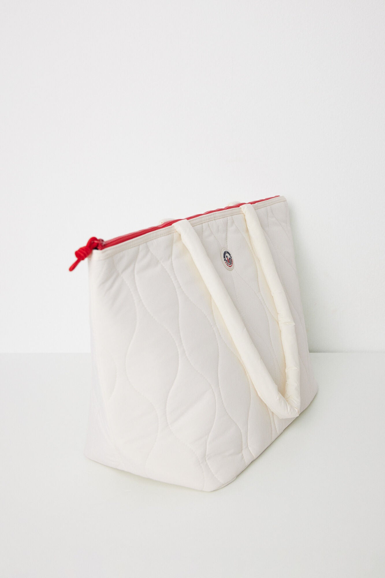 White padded nylon bag