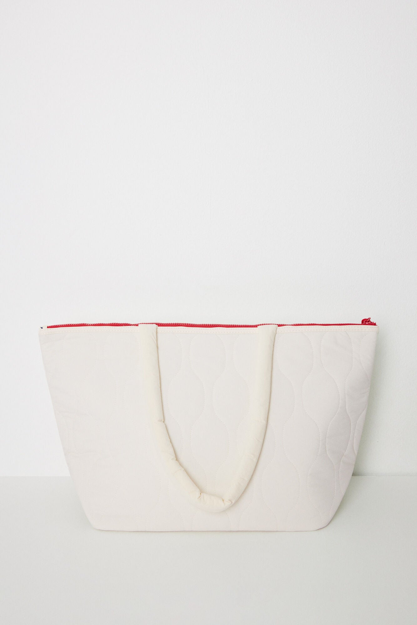 White padded nylon bag