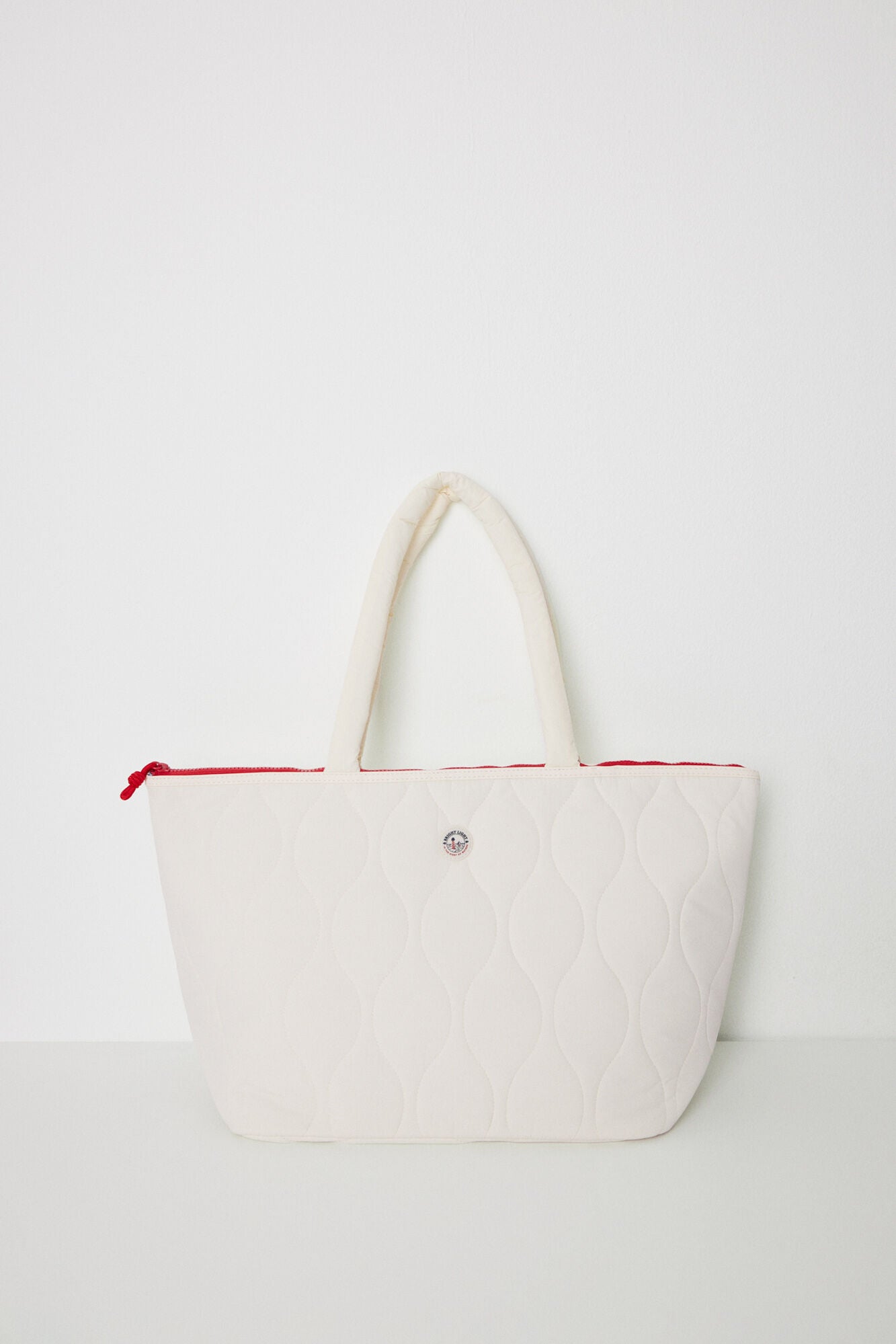 White padded nylon bag