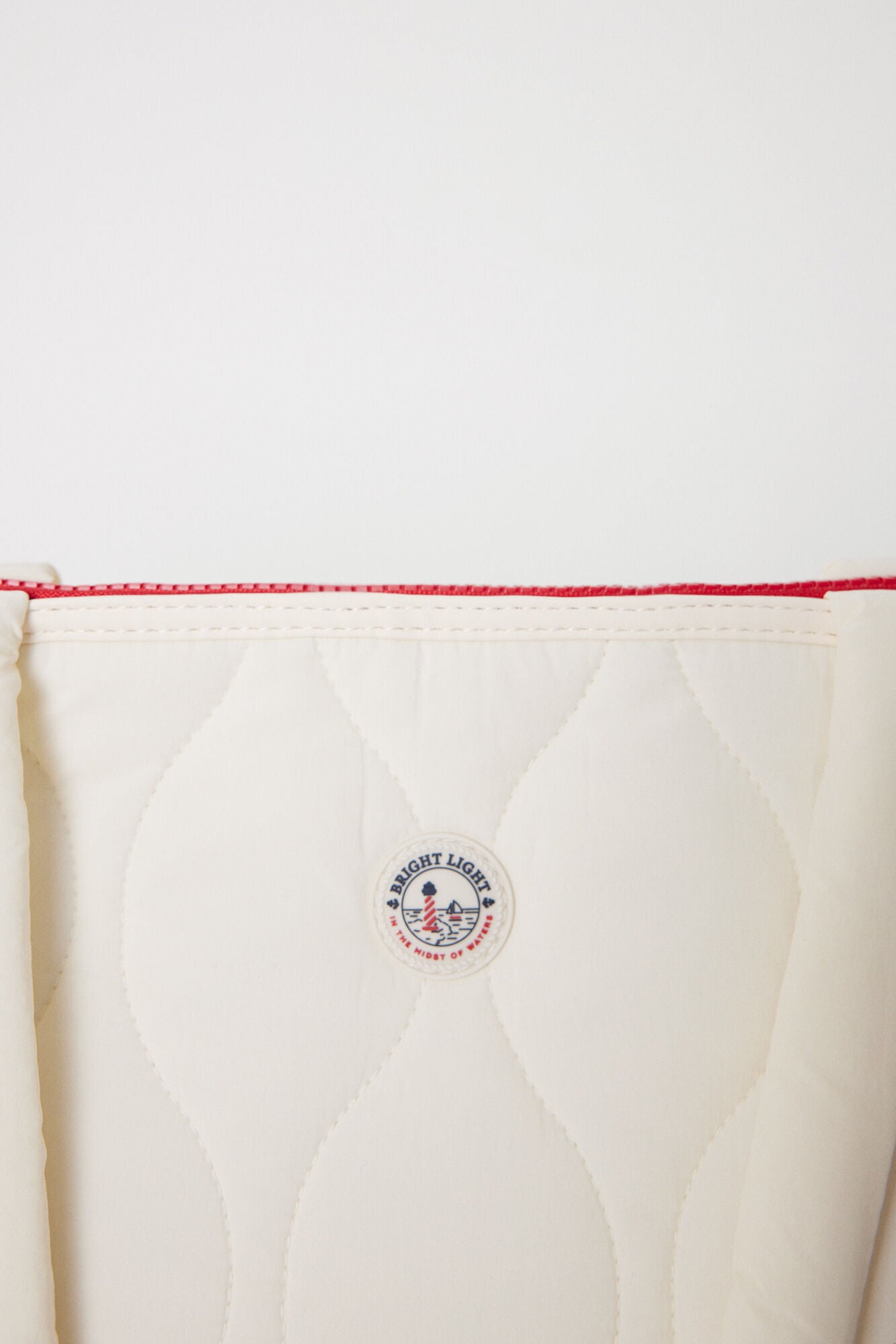 White padded nylon bag