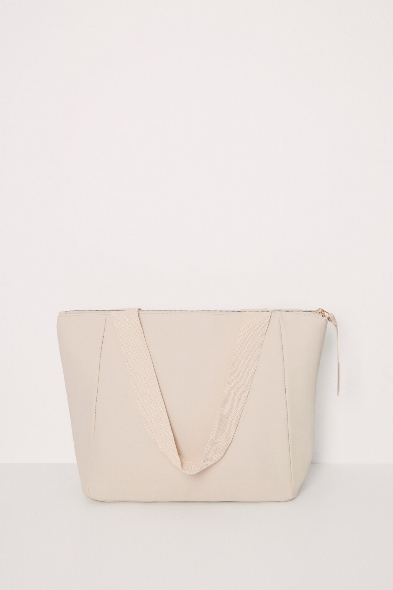 Large beige rubberized bag