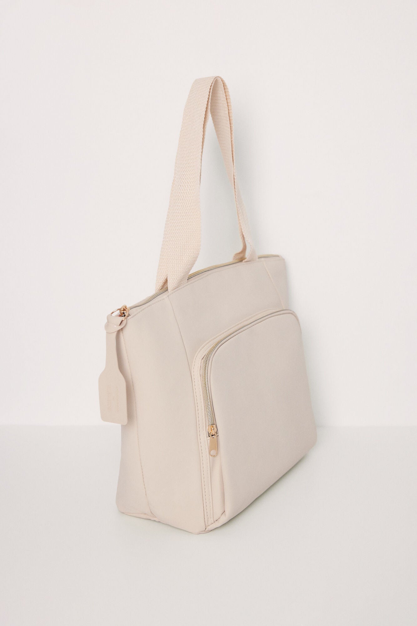 Large beige rubberized bag