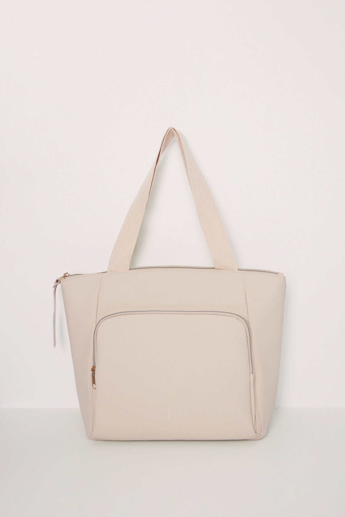 Large beige rubberized bag